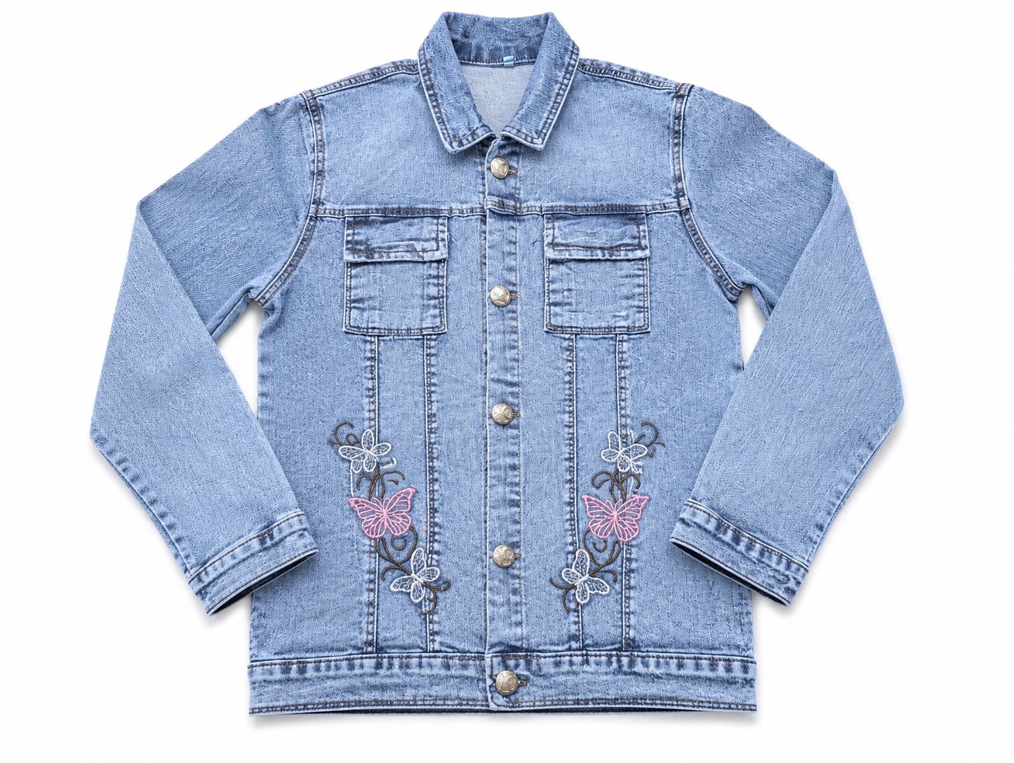 A light blue denim jacket with decorative embroidered butterfly and floral motifs on the front, featuring a button-up front and two chest pockets, shown flat on a white background.