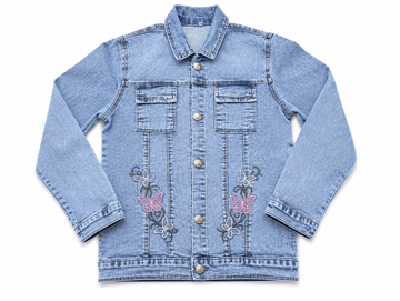A light blue denim jacket with decorative embroidered butterfly and floral motifs on the front, featuring a button-up front and two chest pockets, shown flat on a white background.
