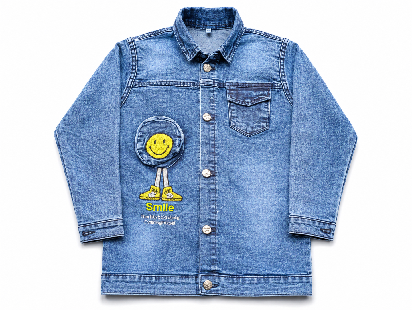 A light blue denim jacket for kids, featuring a yellow smiley face patch applique on the front pocket with the word 'Smile' written below it, shown against a plain white background.