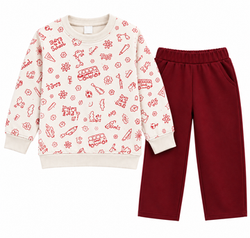 A children's two-piece sweatshirt and pants set on a plain white background. The sweatshirt is cream with a red all-over novelty print, and the pants are solid dark red.