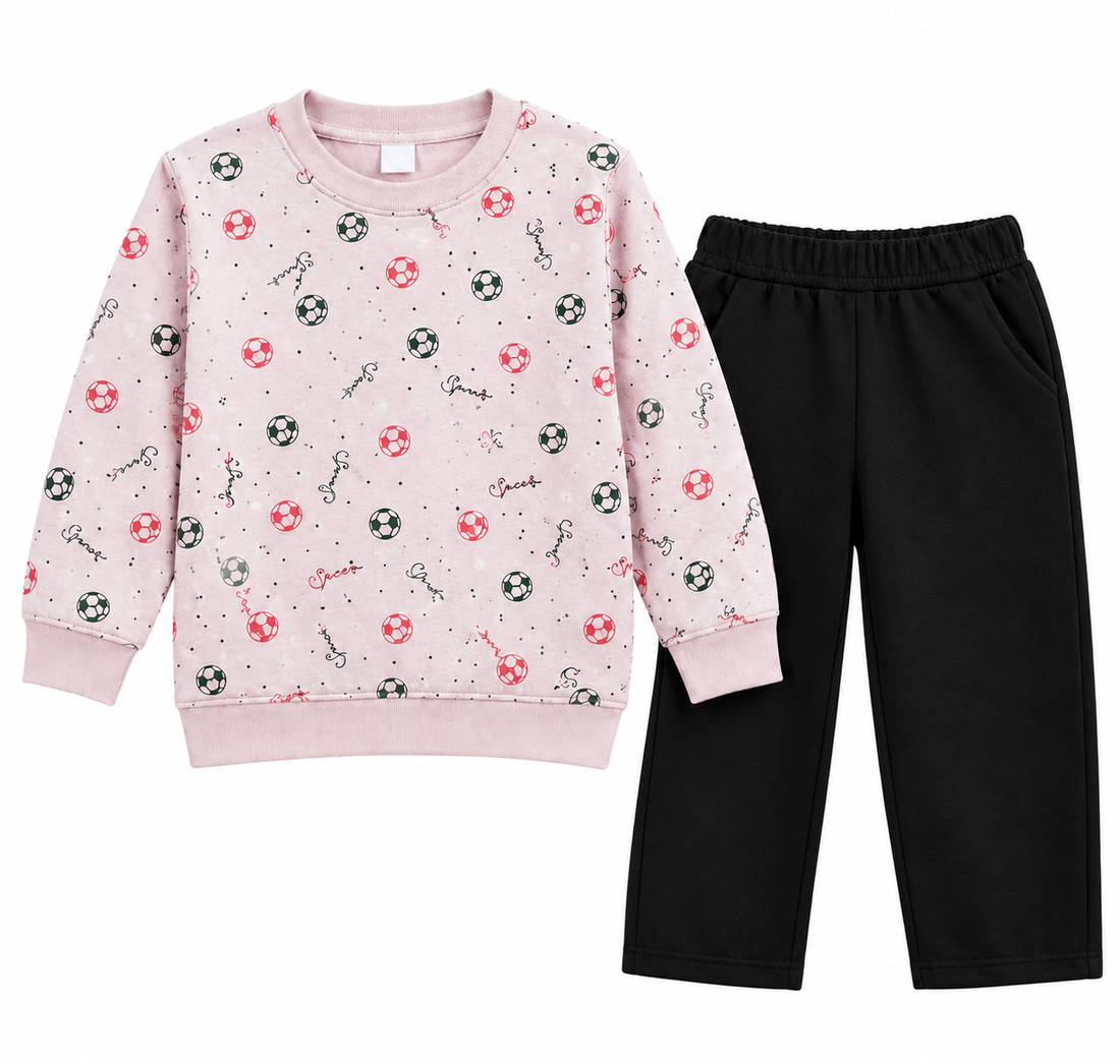 A children's two-piece outfit set featuring a light pink long-sleeve sweatshirt with a pattern of keys, soccer balls, and life preservers, paired with solid black pants, shown on a plain white background.