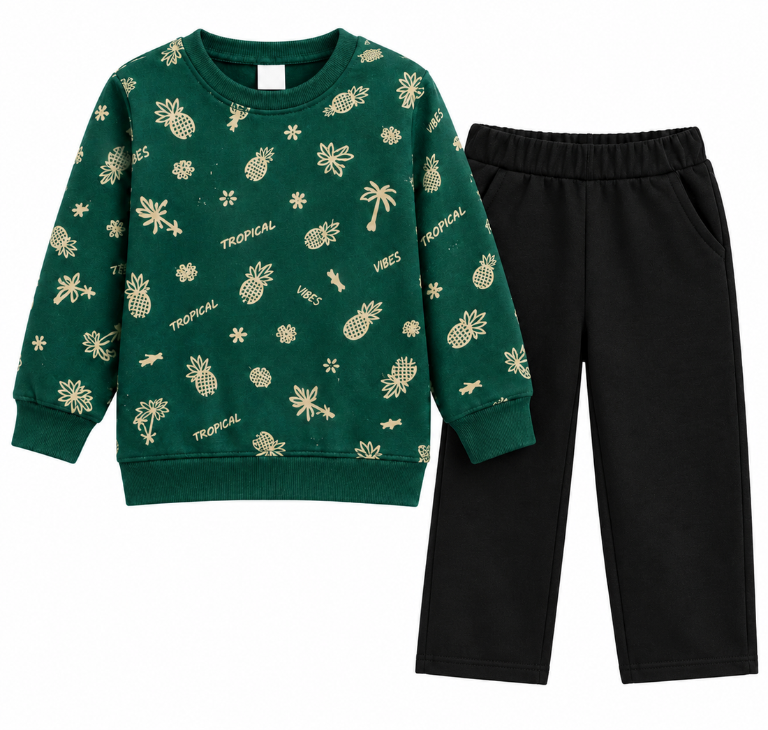 A two-piece kids' outfit set featuring a dark green long-sleeve sweatshirt with a gold tropical pineapple and palm tree print, paired with solid black pants, shown on a plain white background.