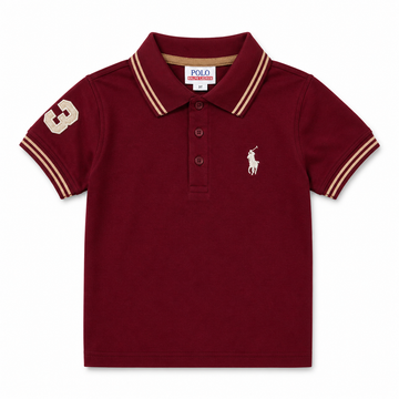 A kids' short-sleeve polo shirt in maroon, featuring cream and tan striped trim on the collar and sleeve cuffs, a cream number 3 on the right sleeve, and the classic Polo Ralph Lauren pony logo embroidered on the left chest.